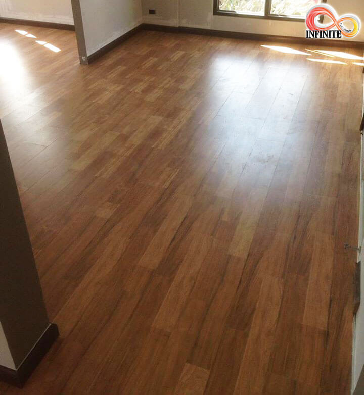 Installed laminate flooring in an empty room